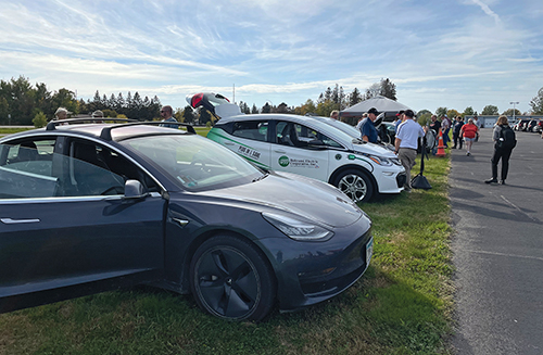 Electric vehicles gathered at an electric vehicle event