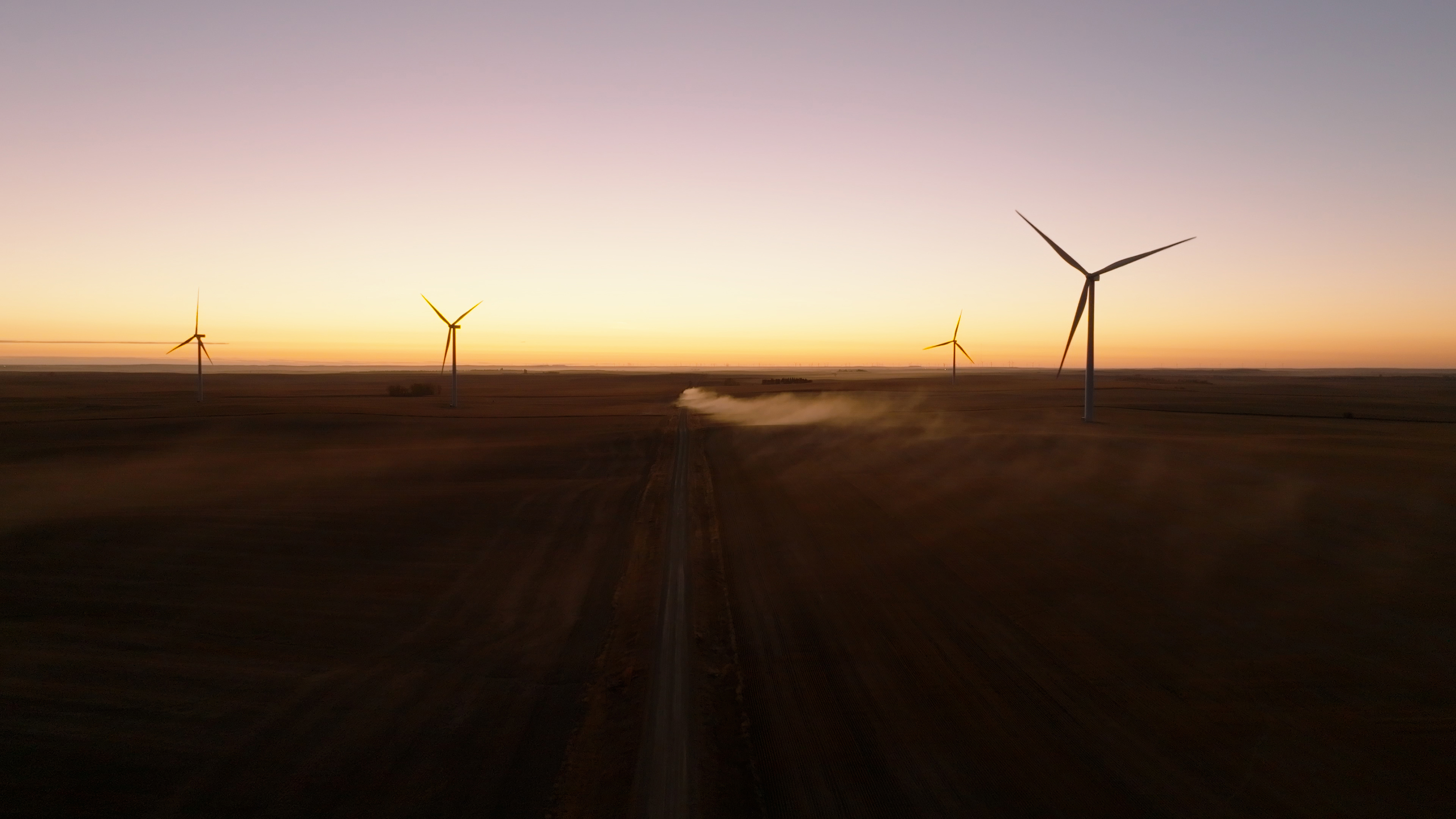 Wind farm from aerial view with green grass