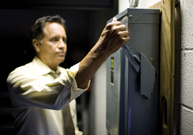 A man working on an electric breaker