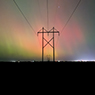 A 230-kV line with the Northern Lights in the background