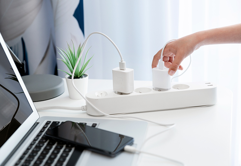 A power strip with a few cords plugged in