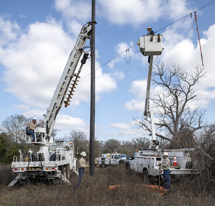 Lineworker crew working on a transmission pole