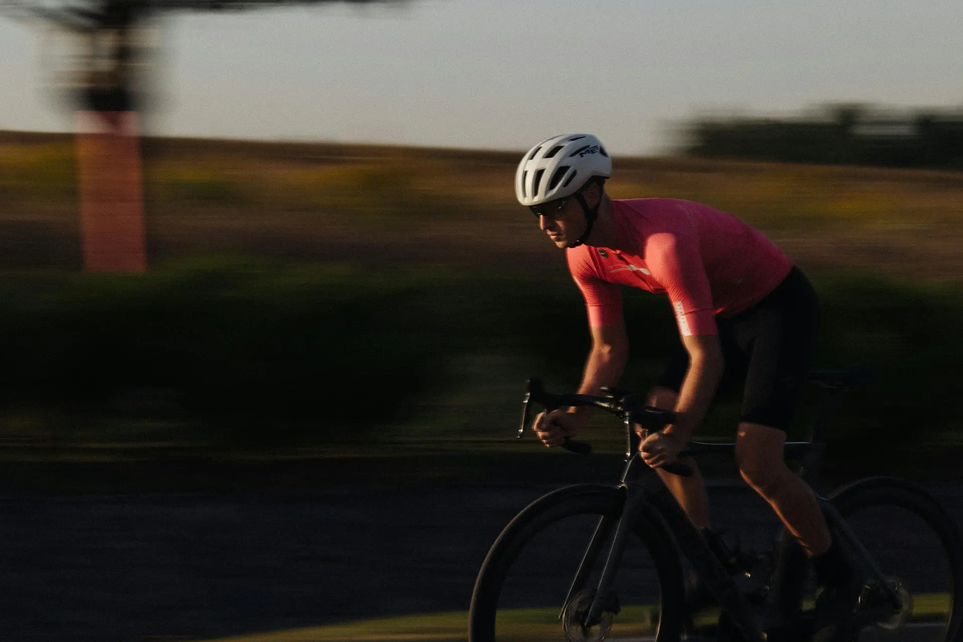 Road cyclist training at sunset — Njinga Cycling coaching