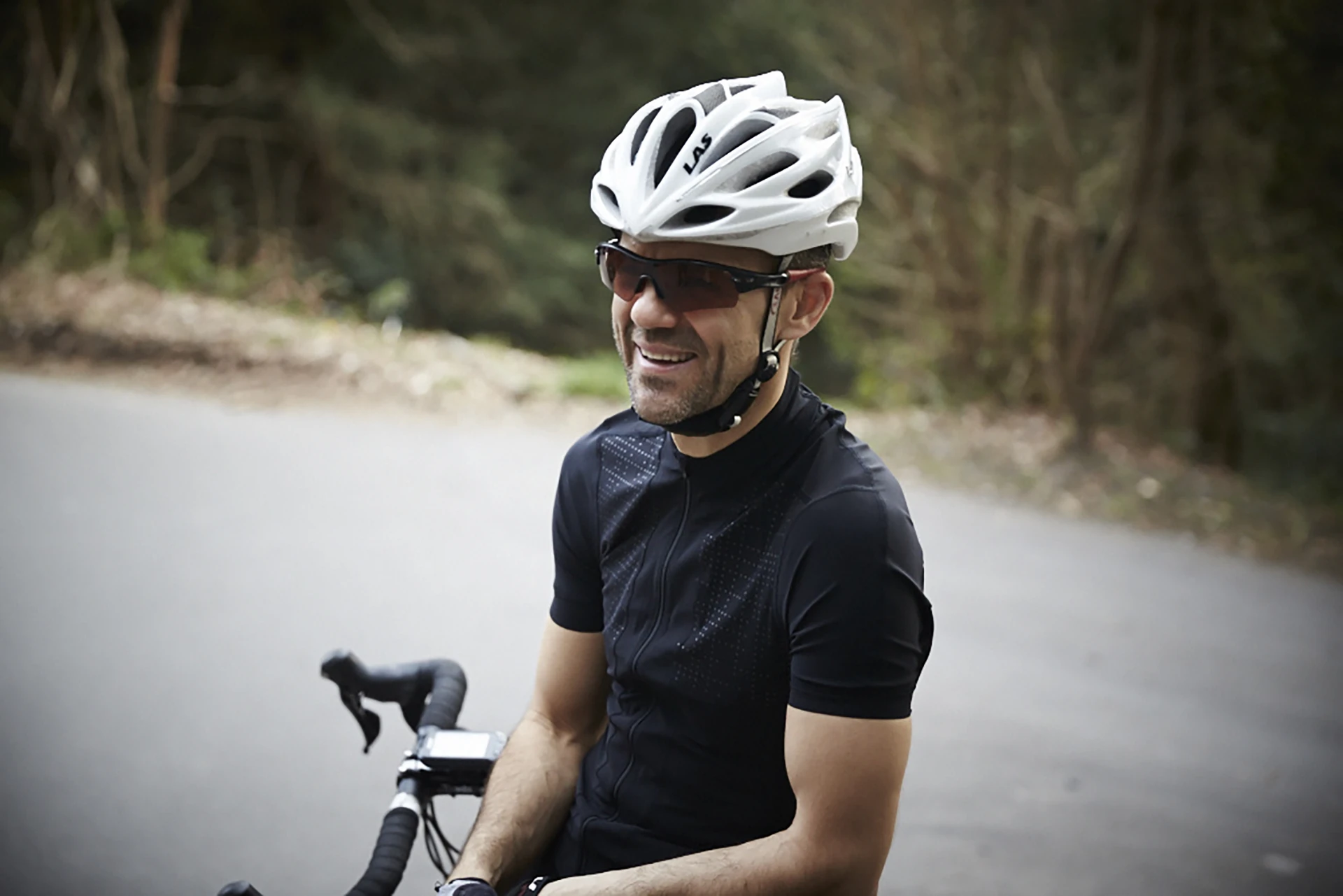 Smiling road cyclist during outdoor training – Njinga Cycling coaching