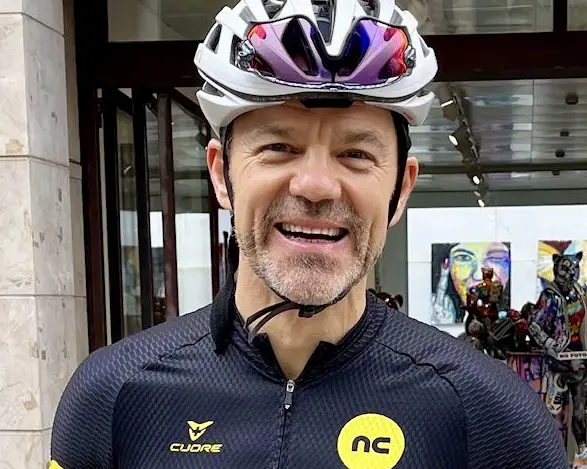 Coach looking at camera smiling: Elevate personalised coaching — watch the intro video