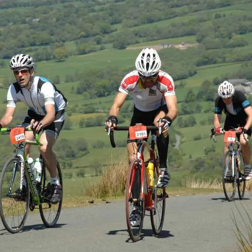 Group of Cyclists climbing Wales