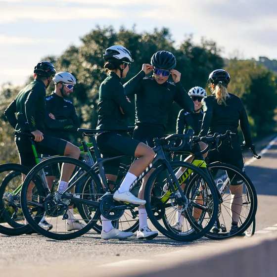 Group cycle training session on the road during sunrise – Accelerate programme by Njinga Cycling