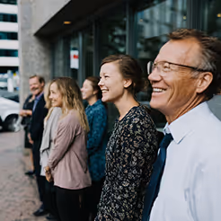 Group of CADSI Cyber Council members standing together and smiling during a meeting break.