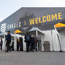 International defence delegates meeting outside the CADSI pavilion at a CANSEC trade show.