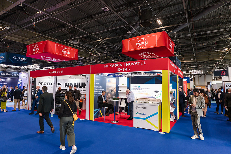 Participants speak together at a previous Canada Pavilion.
