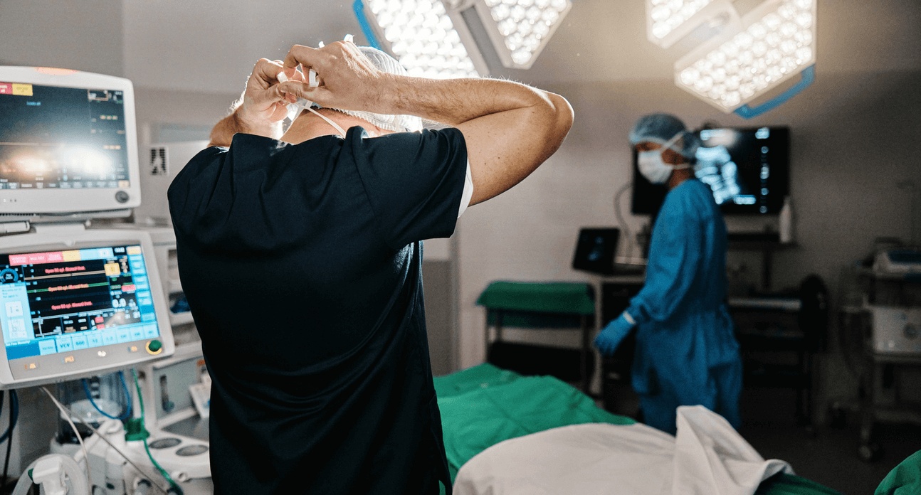 Surgeons preparing an operating room with advanced medical equipment, representing expert spinal procedures performed by the best spine surgeon in Los Angeles.
