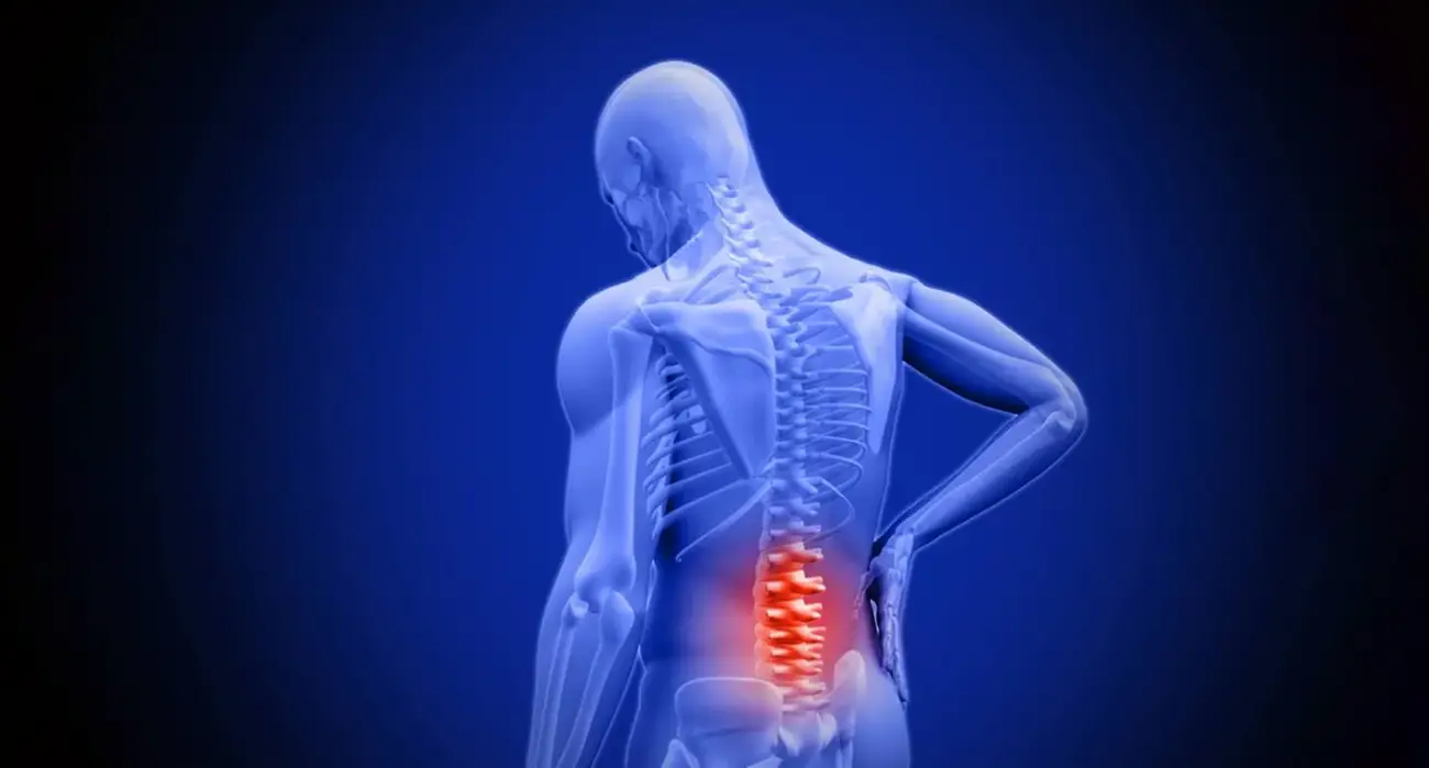Spine specialist reviewing imaging and discussing surgical options for lower back pain with a patient in Los Angeles