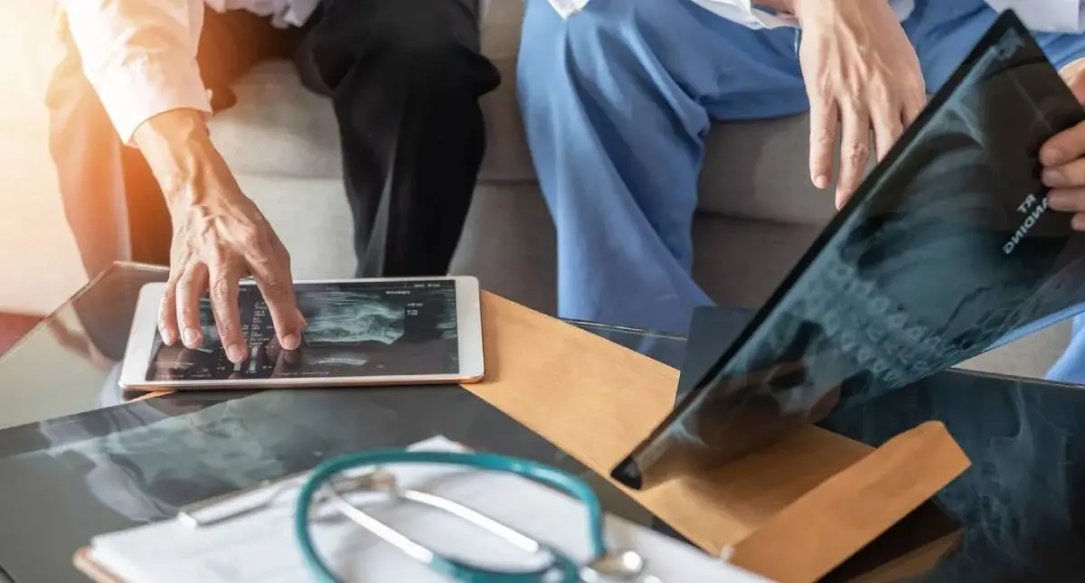 Patient reviewing MRI images with a spine surgeon during a consultation in Los Angeles