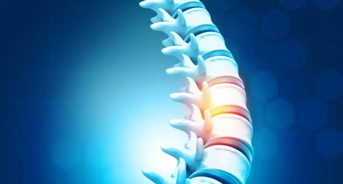 Person doing gentle lower back mobility stretches at home to manage degenerative disc disease symptoms before spine surgery