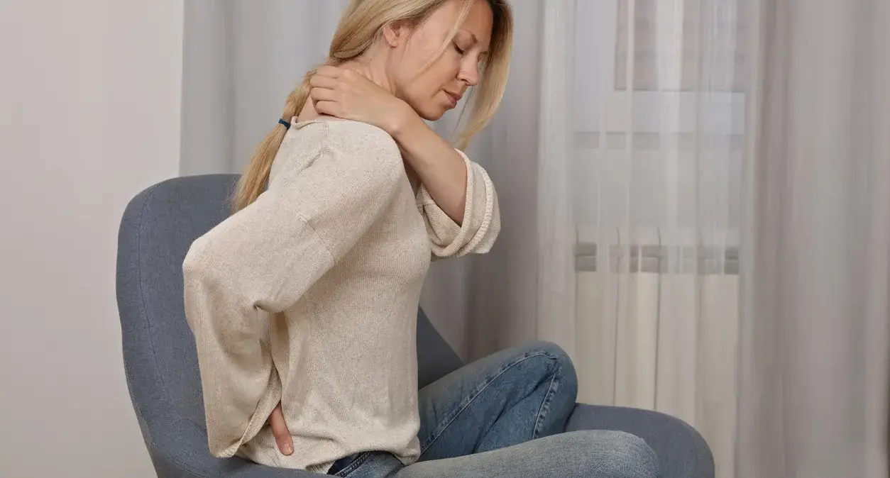 Spine illustration showing a compressed nerve and decompression relieving pressure