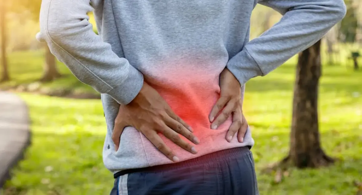 Patient discussing ongoing back and leg pain after spine surgery with a Los Angeles neurosurgeon