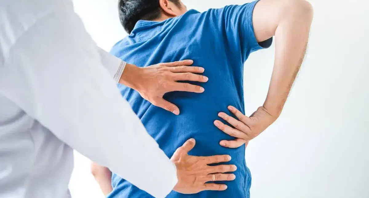 Adult stretching the lower back and hips to ease osteoarthritis-related stiffness