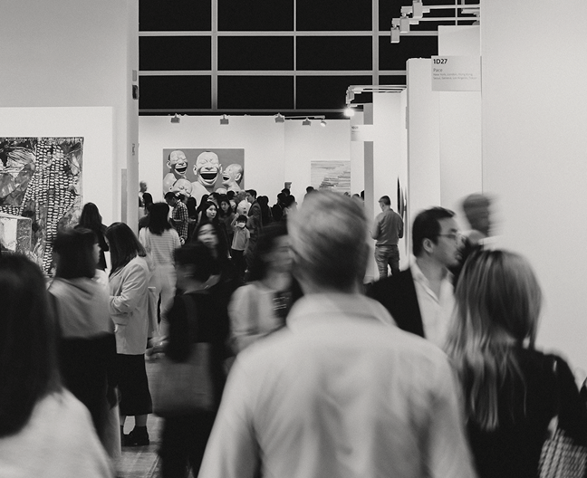 People mingle in a crowded and lively event space