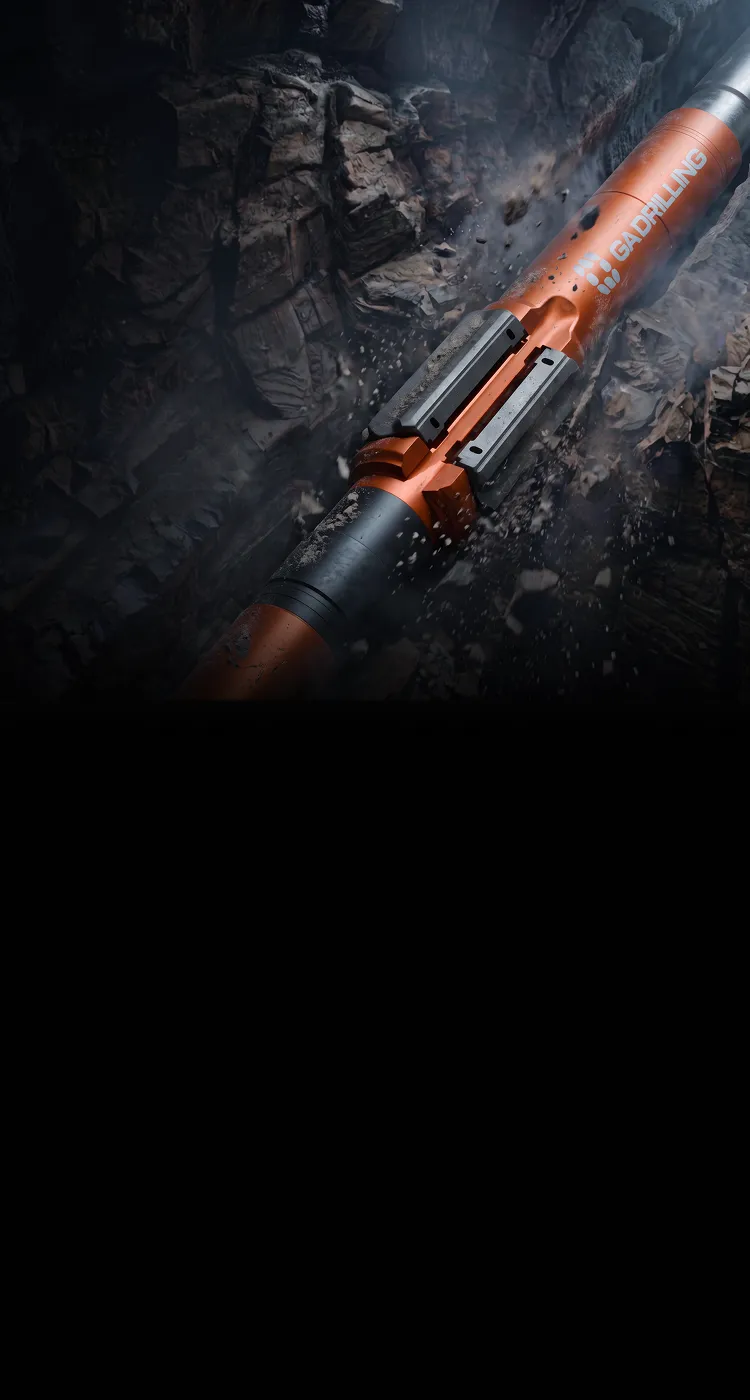 A large orange and black drilling tool labeled 'GADRILLING' breaking through rock underground, with debris and dust flying around.