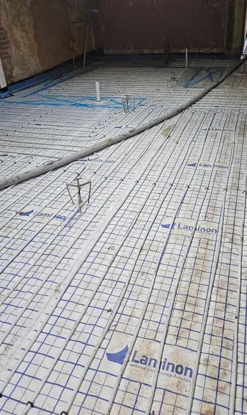 Underfloor heating pipework being installed during an MB Build renovation