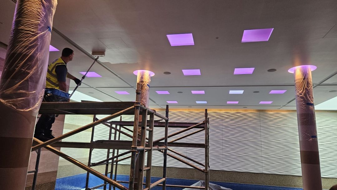 MB Build tradesperson completing finishing work from site scaffolding