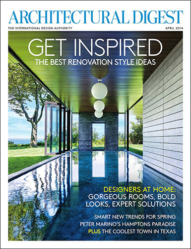 Architectural Digest magazine cover for the April 2014 issue that features a CNR Group luxury home construction project. The cover shows a modern indoor pool with glass walls overlooking greenery.