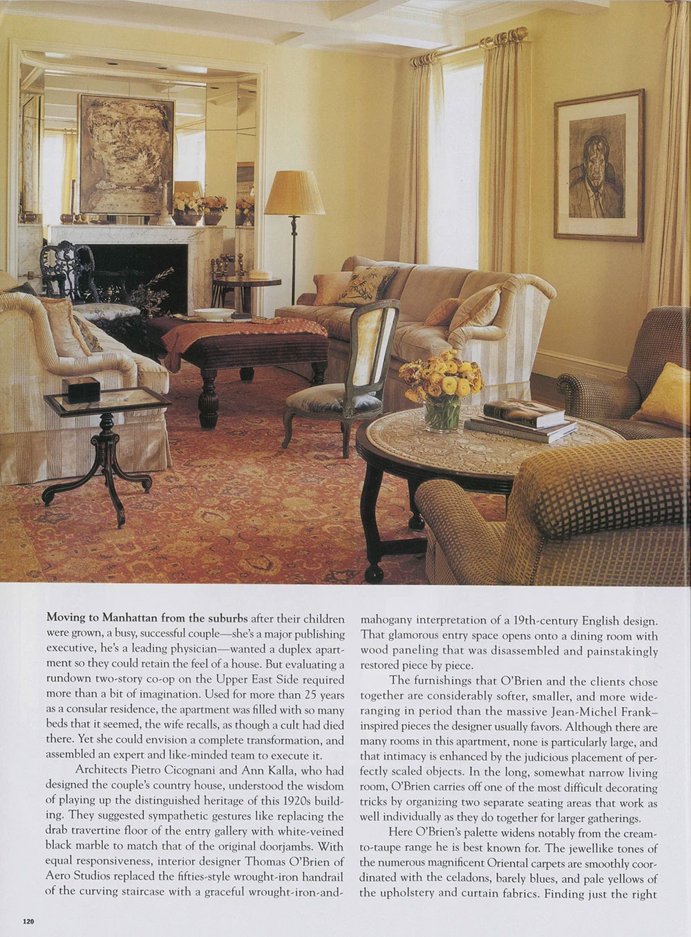 CNR Group luxury home build interior: a cozy living room with beige striped sofa, patterned armchairs, a round wooden coffee table with flowers and books, a floor lamp, and a large ornate rug.