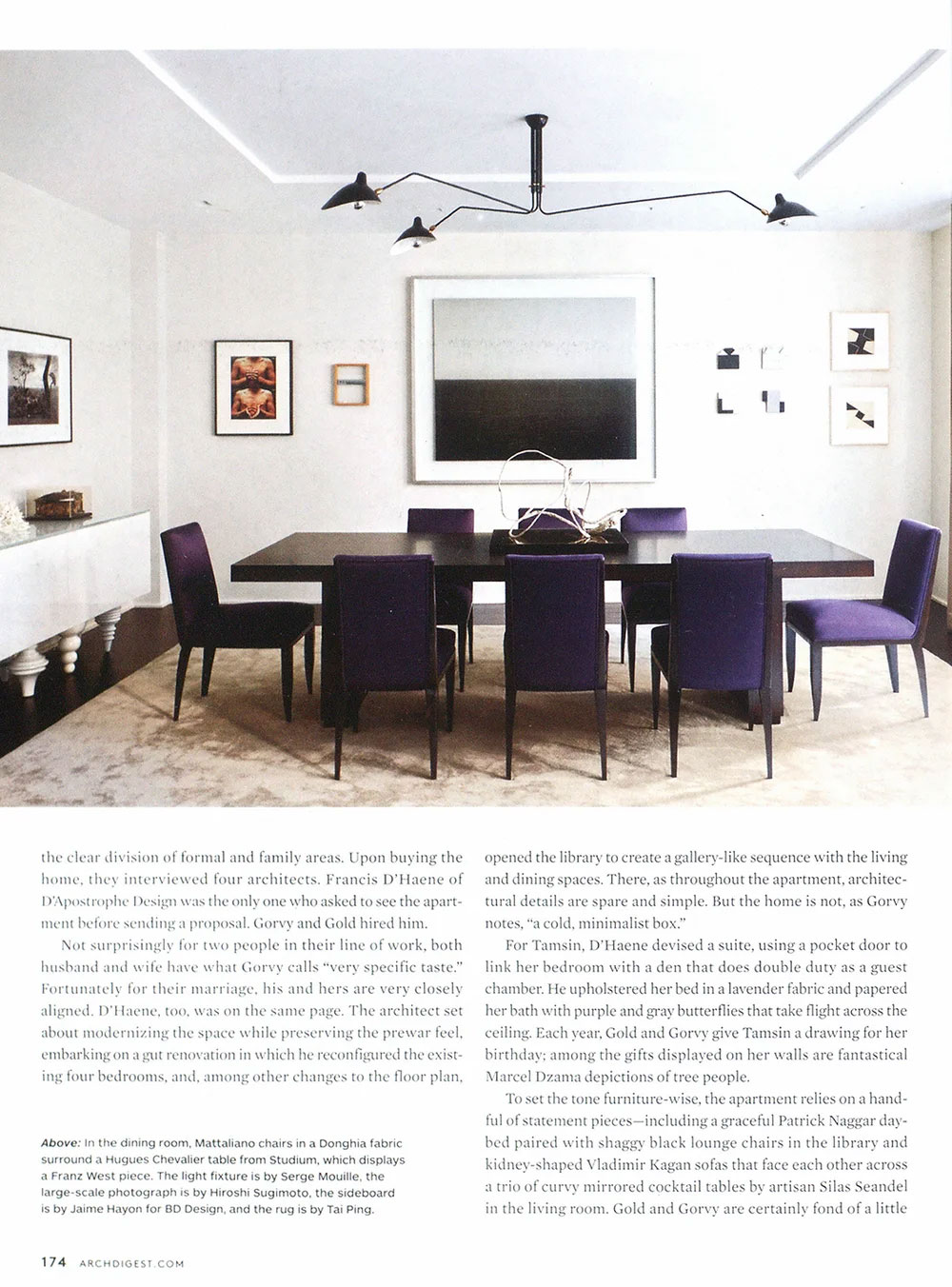CNR Group luxury home builders interior: Modern dining room with a dark rectangular table surrounded by eight purple chairs, abstract artwork on white walls, and a minimalist black ceiling light fixture.