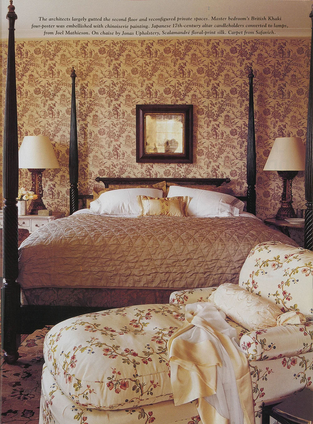 A CNR Group luxury home master bedroom with British Khaki four-poster bed featuring chinoiserie wallpaper, floral chaise lounge with throw blanket, and matching lamps.