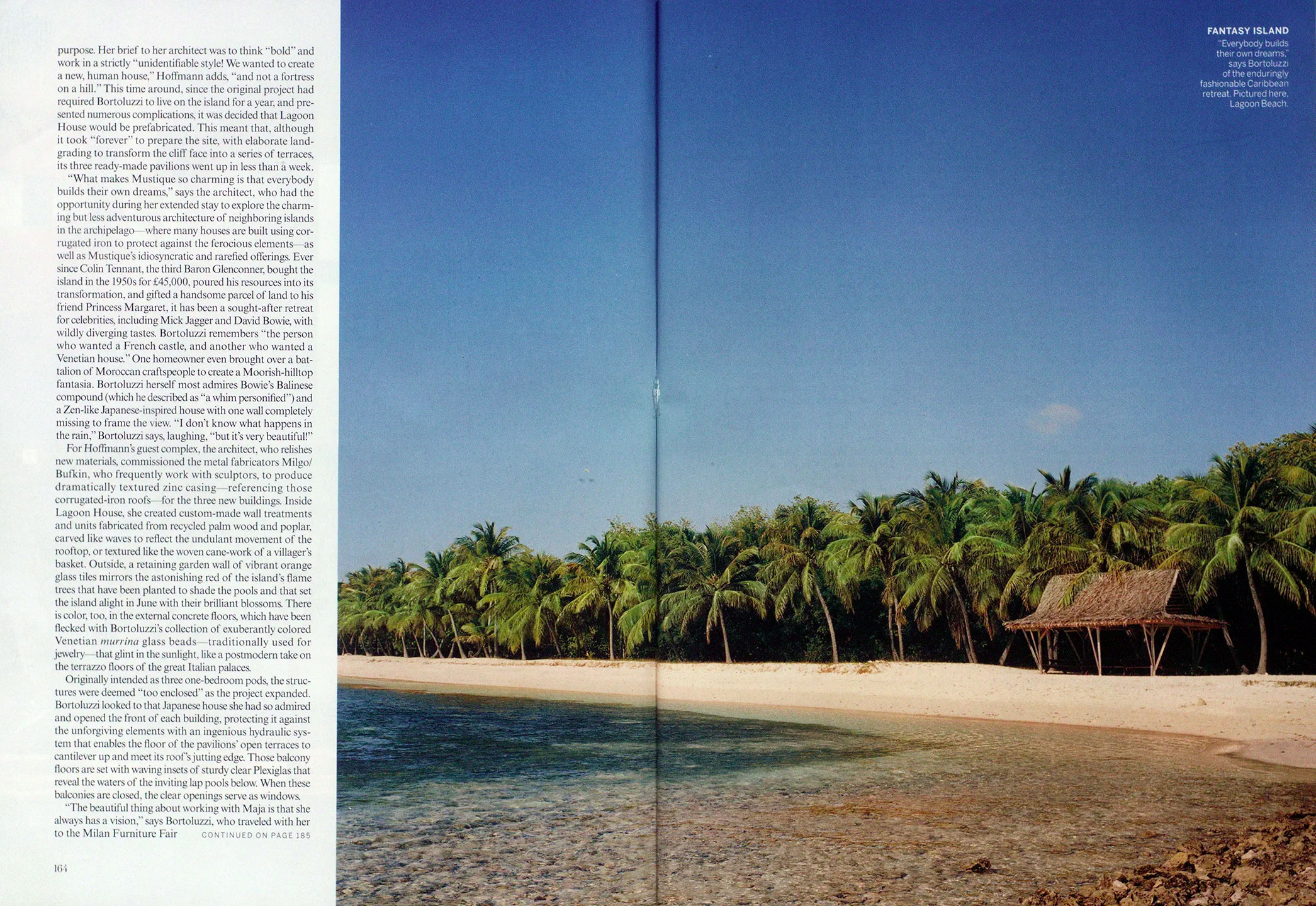 Tropical beach with clear shallow water, white sand, palm trees, and a small thatched hut under a clear blue sky at Lagoon Beach alongside text for an article featuring CNR Group luxury home builders.