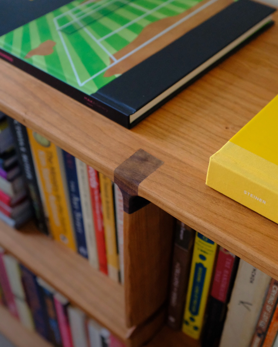 A photo of unique custom made bookshelves beautifully stained. 