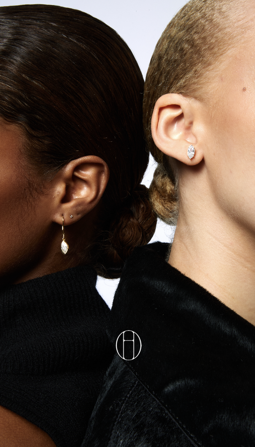 Brand icon over jewelry detail