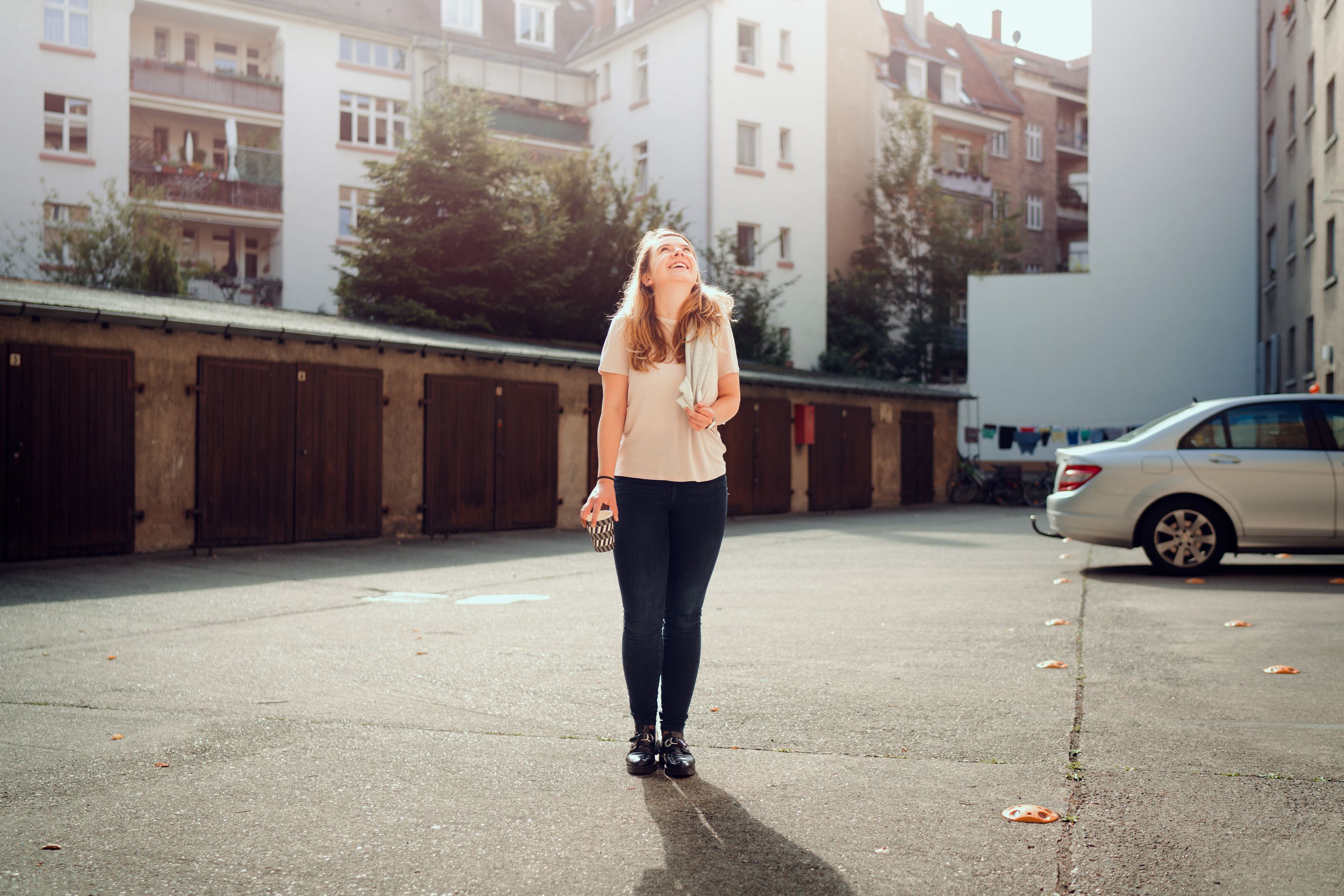 Marie in front of garage