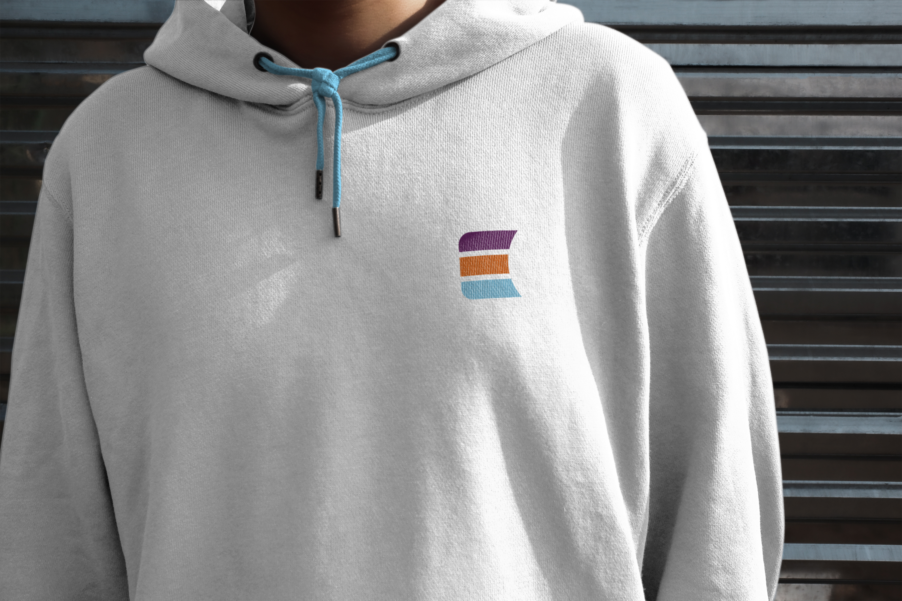 grey hooded sweatshirt with "E" logo and blue strings