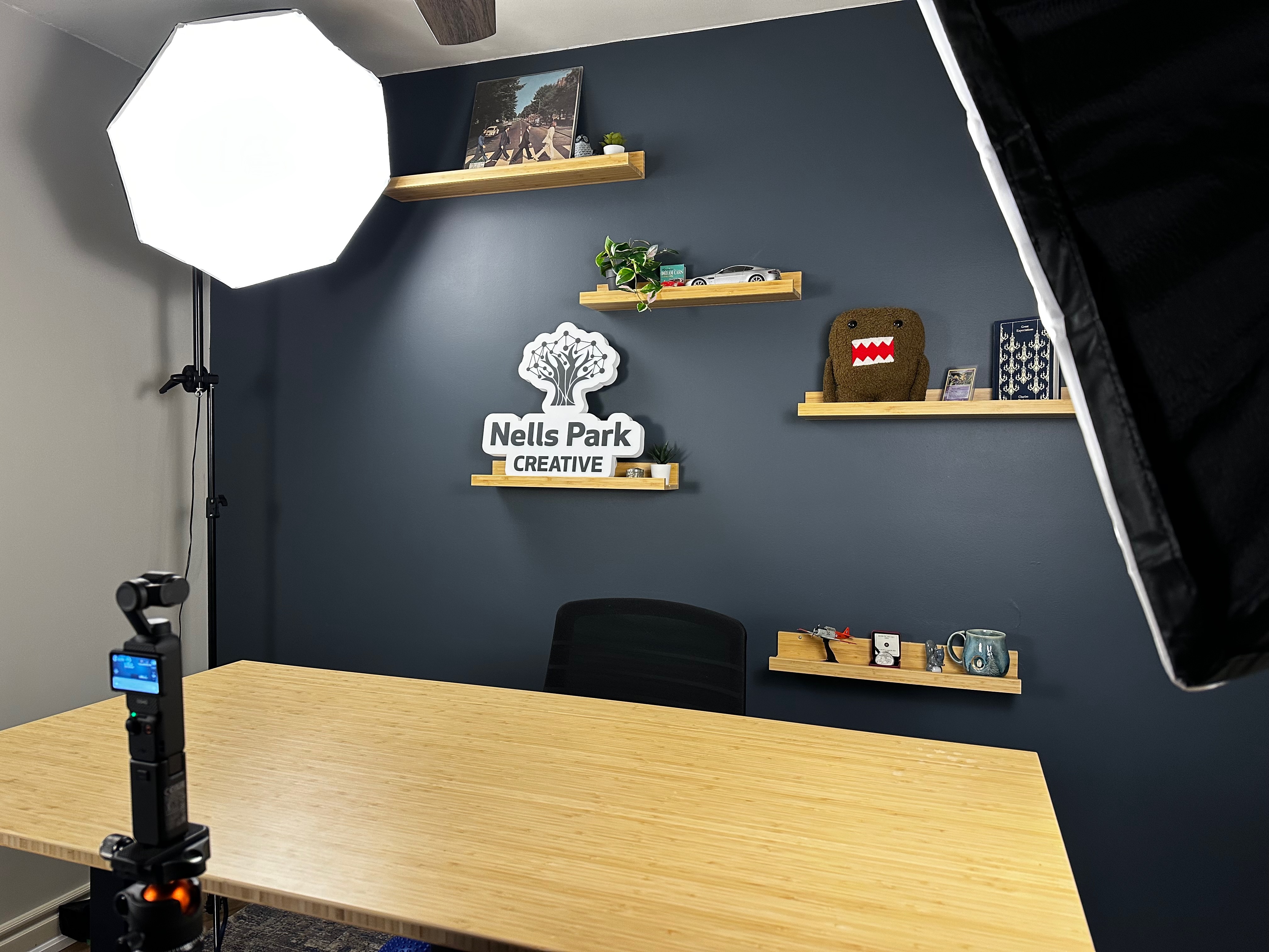 Optimized YouTube studio setup featuring a camera, softbox lighting, and an organized background for filming.