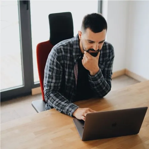 Fictive team member - man with laptop