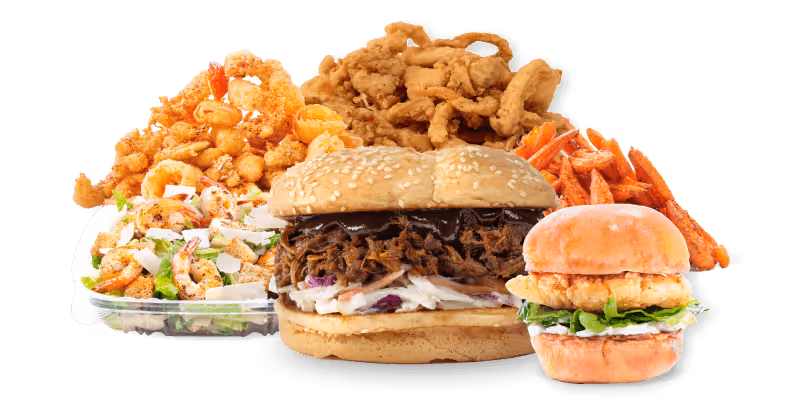 Assorted fast food items including sandwiches, fried chicken, salad, sweet potato fries, and fried onion rings.