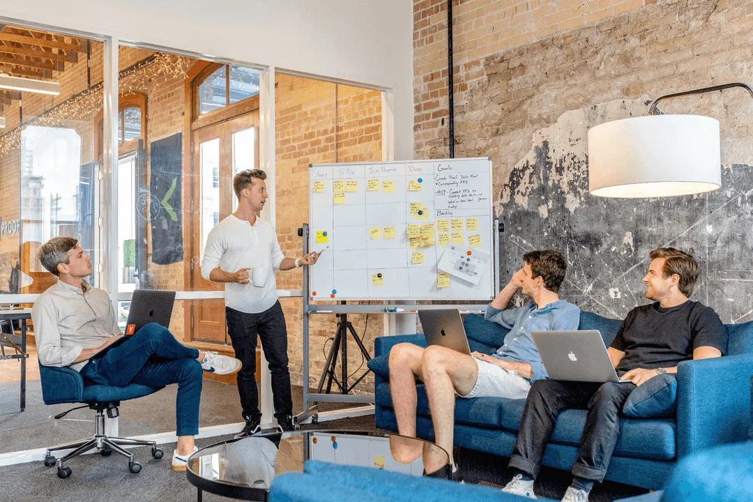 People in a meeting talking.
