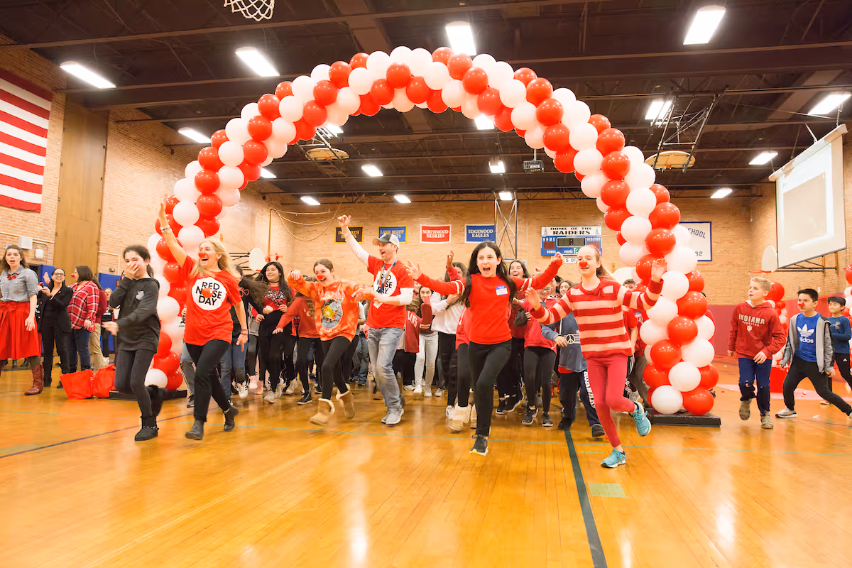 Lori leads her students in a Red Nose Day cheer. 