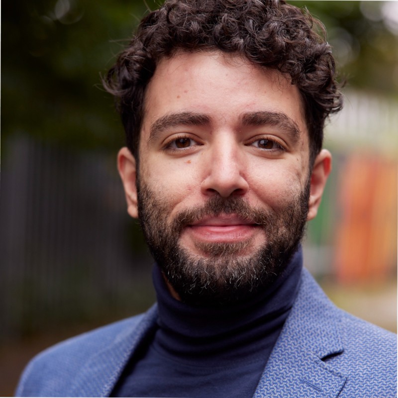 A picture of the founder Adam, he looks super handsome with his turtleneck