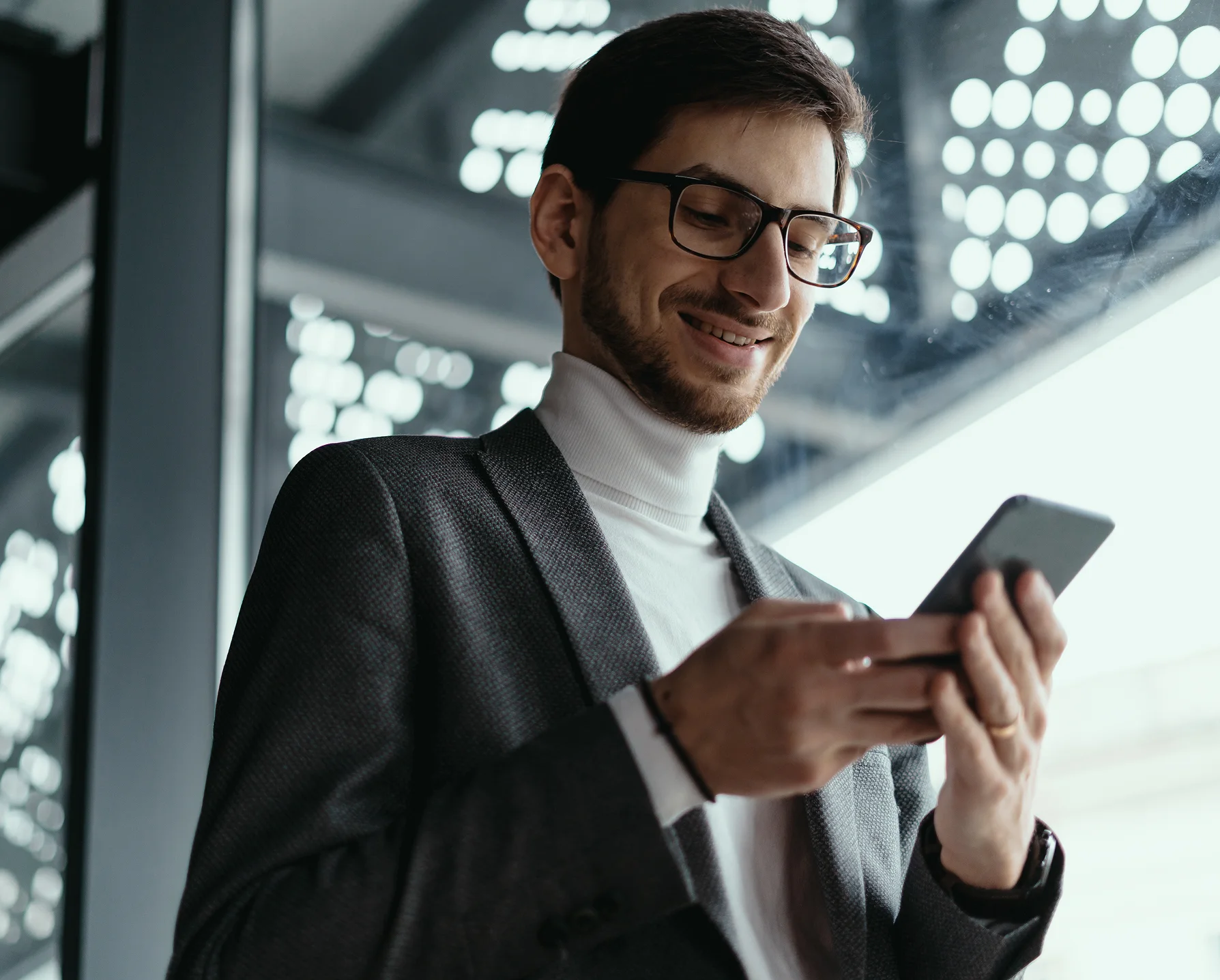 a smiling man is reviewing his communications with mowing best