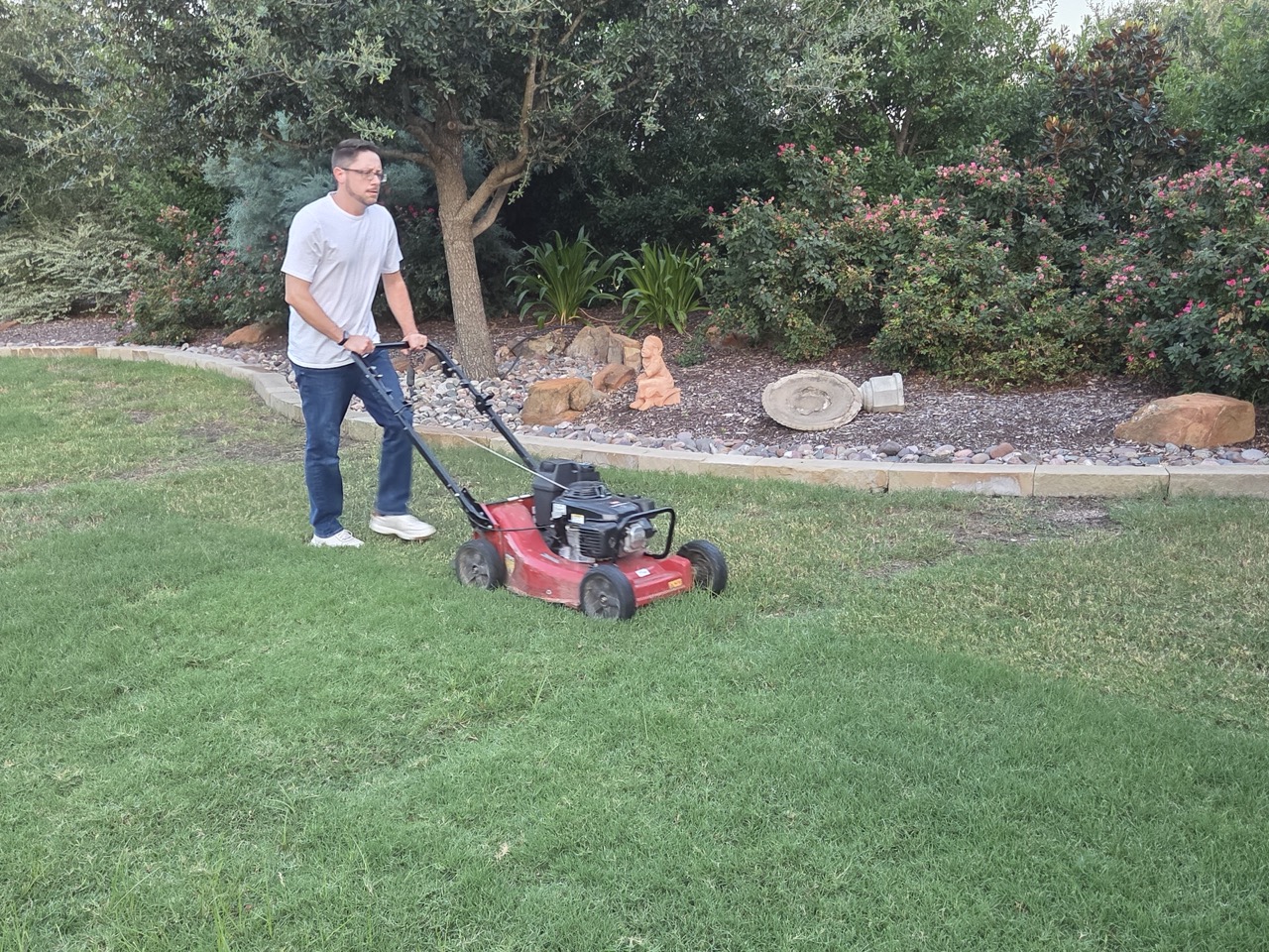 Mowing Best team member mowing a residential lawn