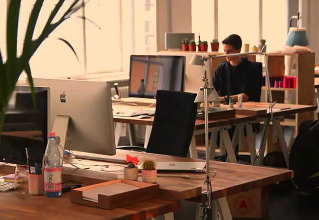 engineering team member working at a desk in the office