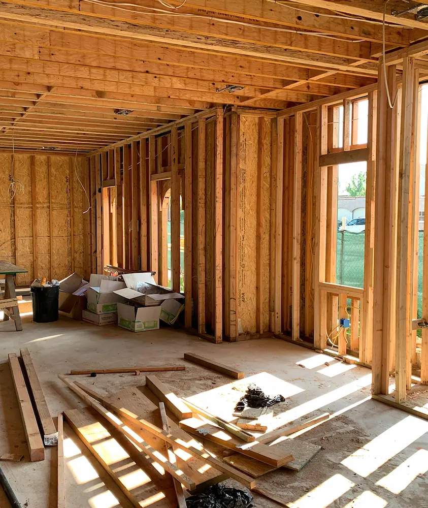 Residential construction framing interior representing architectural and engineering coordination during the building process