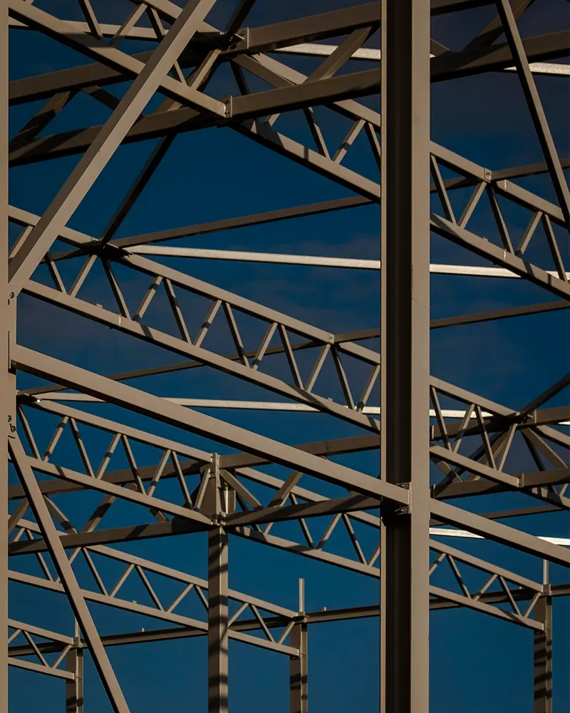 Structural steel framework symbolizing ECOSI’s purpose of connecting regional needs with technical expertise