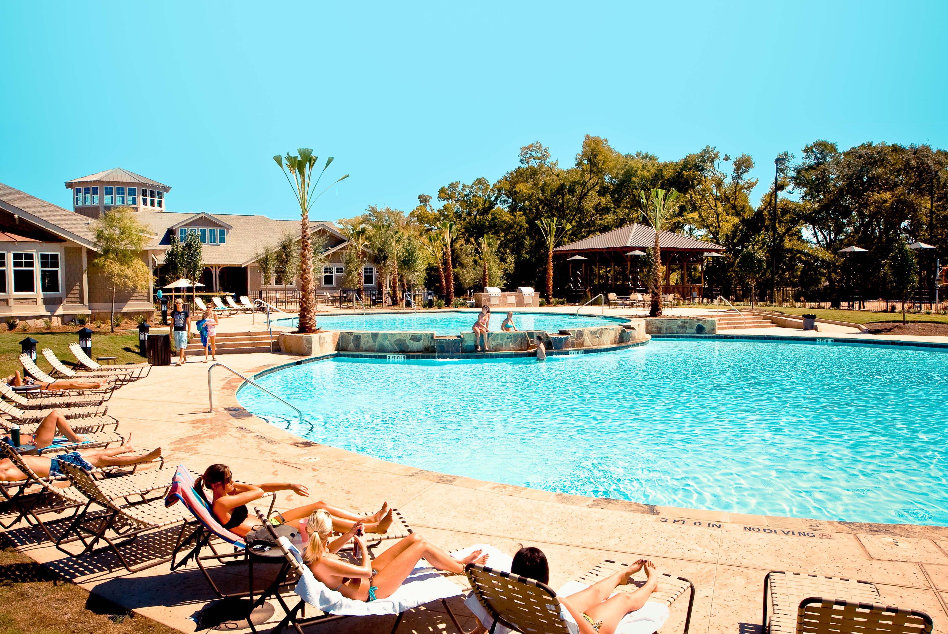 Swimming pool with people lounging