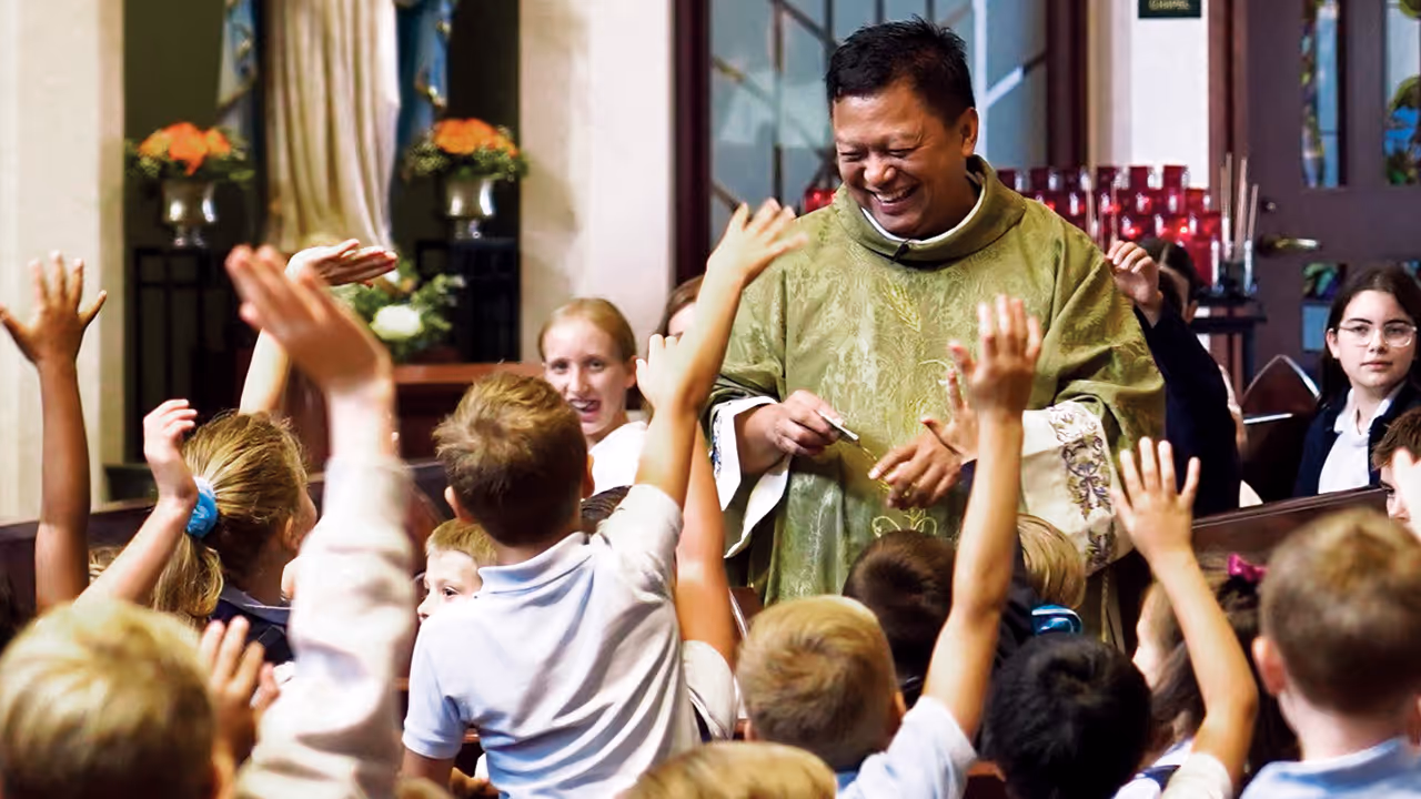 Priest with parochial school class