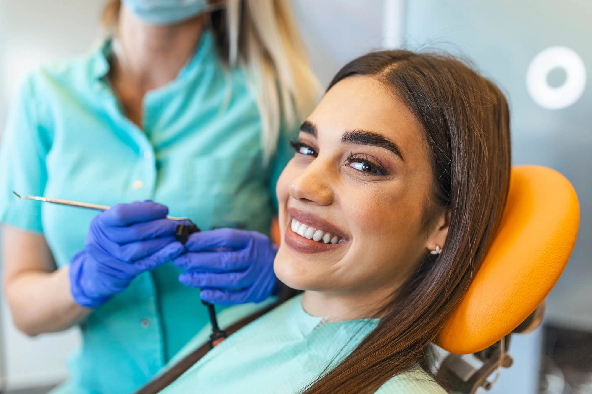 Girl showing off her affordable denture implants
