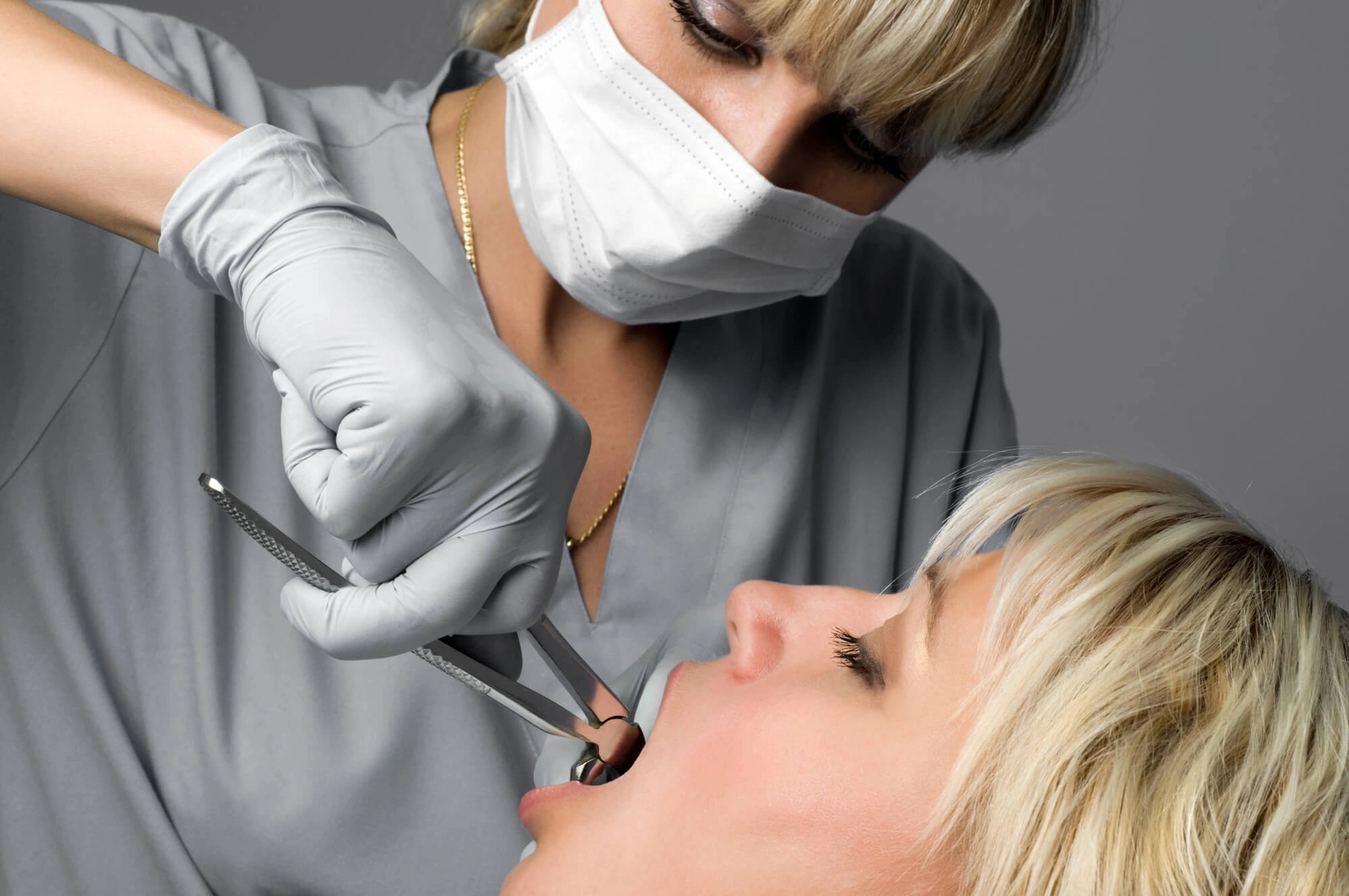 woman and dentist for tooth extraction