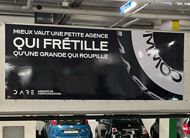 DARE | Brand factory campagne d'affichage dans un parking à Lausanne